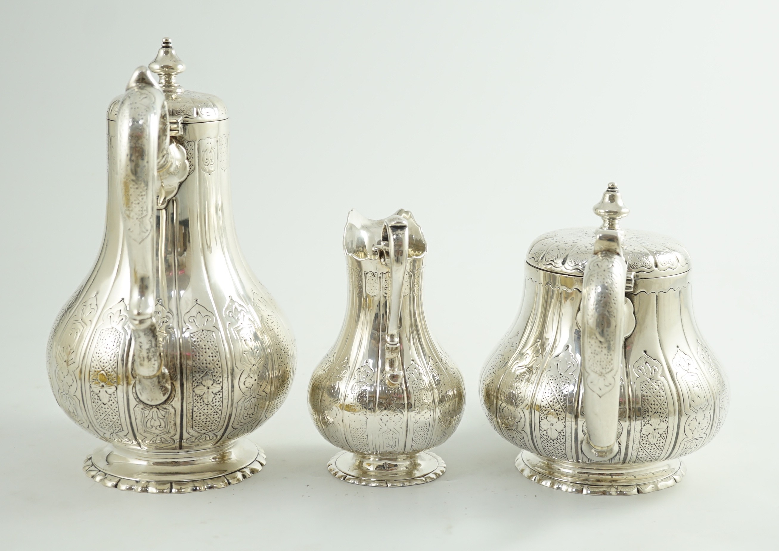 A Victorian silver three piece coffee set, comprising pot, cream and sugar bowl, by Walter Morrisse